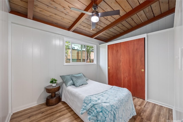 2445 Komo Mai Dr, Pearl City, HI 96782 - bedroom featuring wood ceiling, lofted ceiling with beams, wood finished floors, and a closet