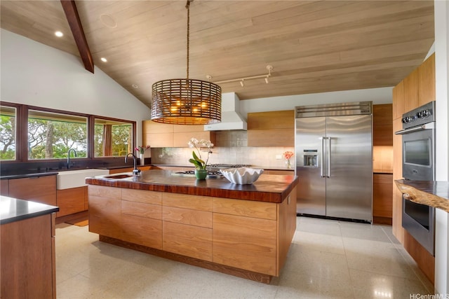 376 Dune Cir, Kailua, HI 96734 - kitchen featuring stainless steel appliances, modern cabinets, a large island with sink, dark speckled floor, and recessed lighting