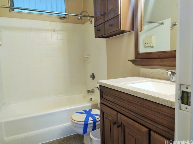 bathroom with vanity, toilet, and bathing tub / shower combination