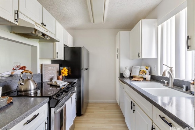 kitchen featuring a sink, dark countertops, white cabinetry, and electric stove