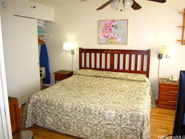 bedroom with a ceiling fan and wood finished floors