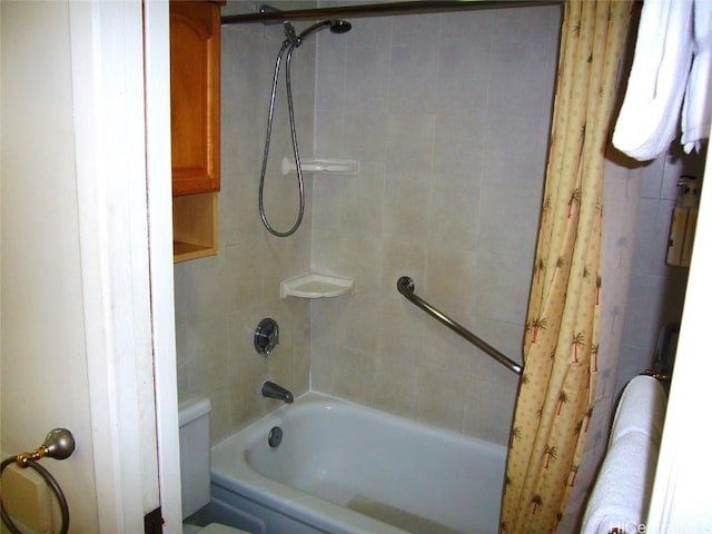 bathroom with toilet and shower / tub combo