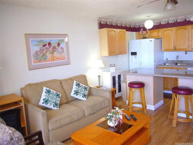201 Ohua Ave Unit 2112Mauka, Honolulu, HI 96815 - living area with light wood-type flooring and a textured ceiling