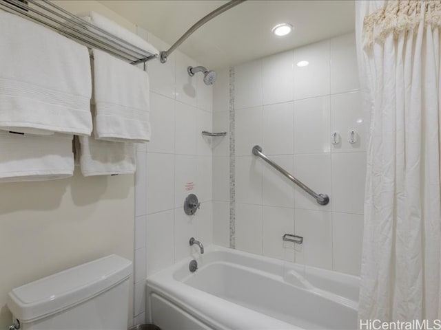 bathroom with shower / tub combo and toilet