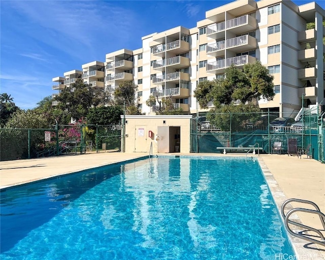 view of pool with fence