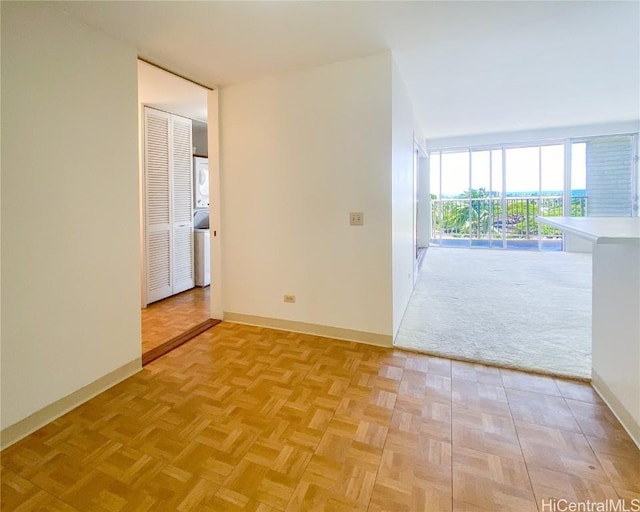 empty room featuring baseboards