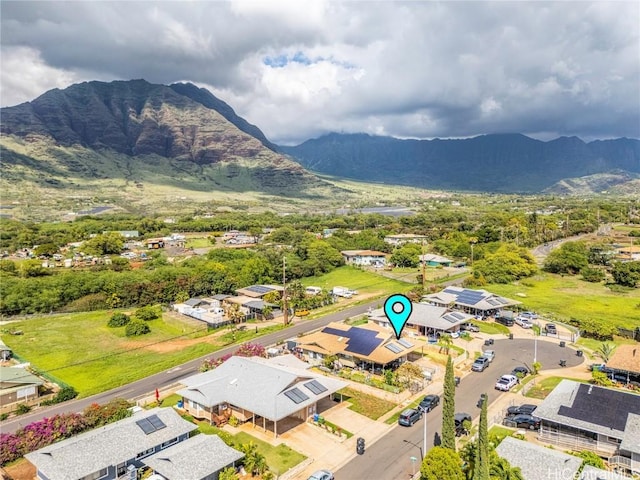 birds eye view of property with a mountain view