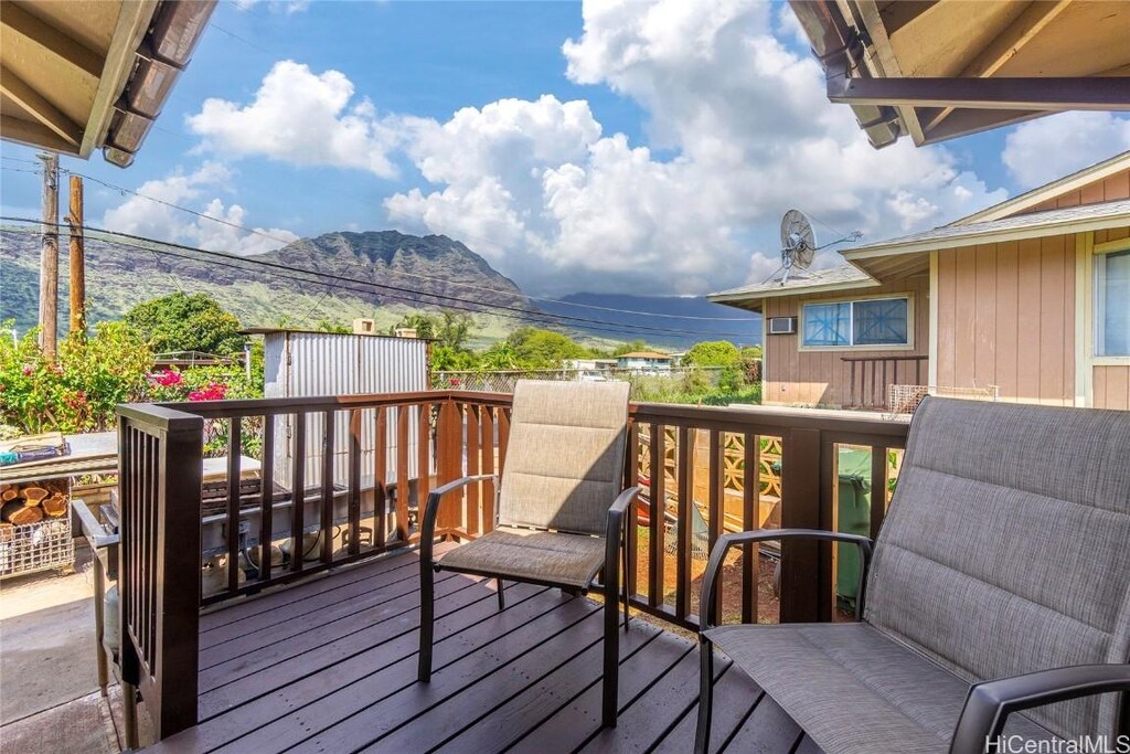 wooden deck with a mountain view
