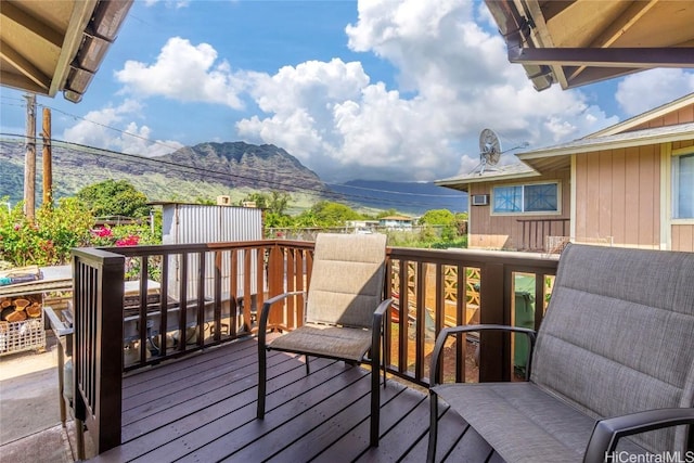 wooden deck with a mountain view