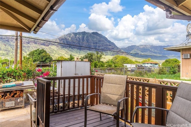 wooden deck featuring a mountain view