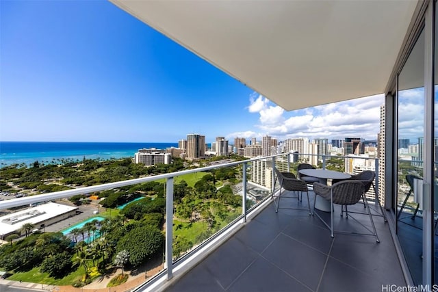 balcony featuring a view of city and a water view