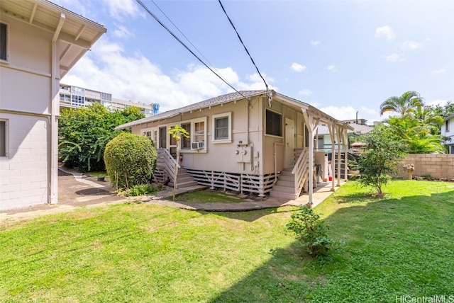 exterior space with a yard and fence