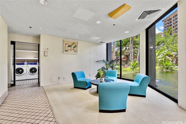 interior space featuring visible vents and washing machine and clothes dryer