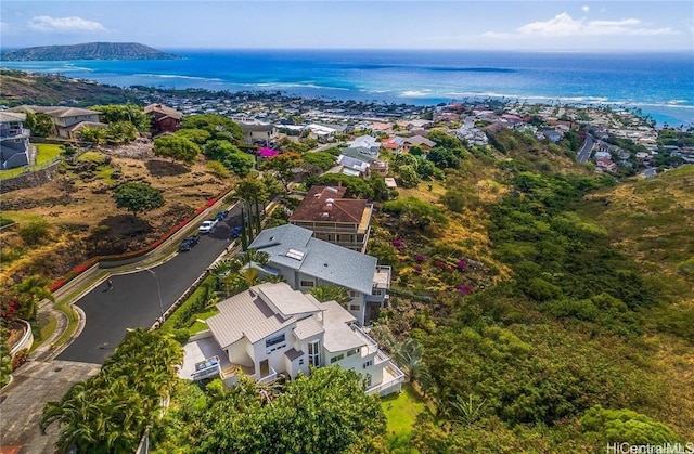 birds eye view of property with a water view and a residential view