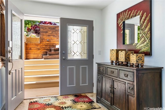 foyer featuring light tile patterned floors