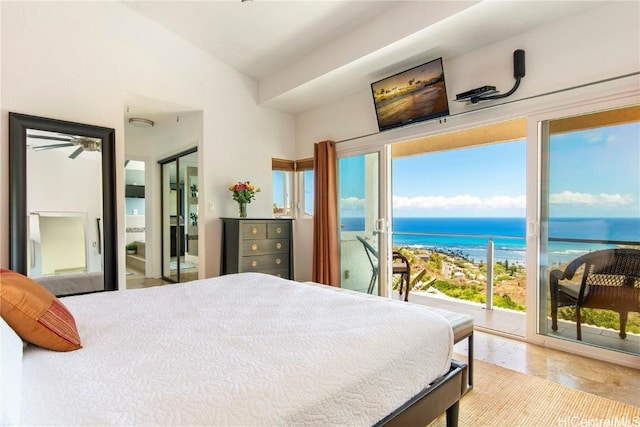 bedroom featuring lofted ceiling and access to outside