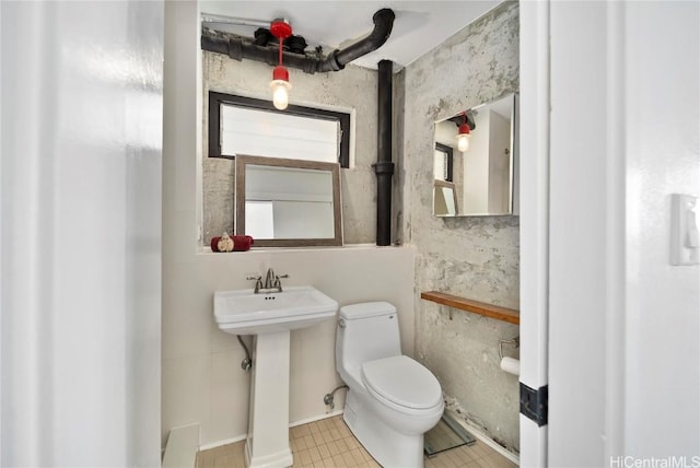 half bath with a sink and toilet