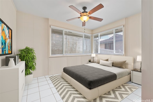 bedroom with light tile patterned floors and a ceiling fan