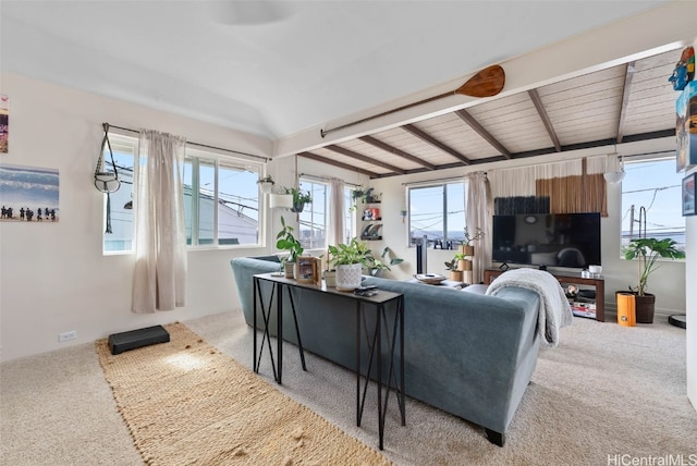 living room with carpet and beam ceiling