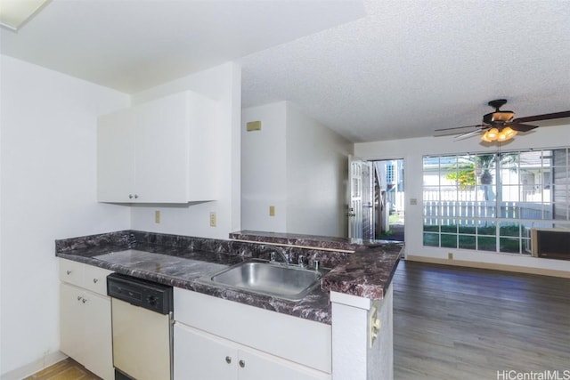 kitchen featuring white cabinets, dishwasher, open floor plan, light wood-type flooring, and a sink