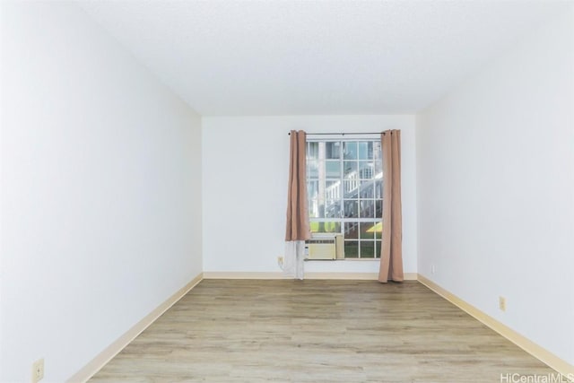 spare room featuring light wood-style flooring