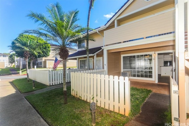 view of property exterior featuring fence