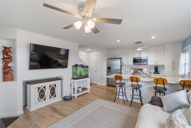91-418 Makalea St Unit 92, Ewa Beach, HI 96706 - living room featuring light wood-style floors, a ceiling fan, baseboards, recessed lighting, and visible vents