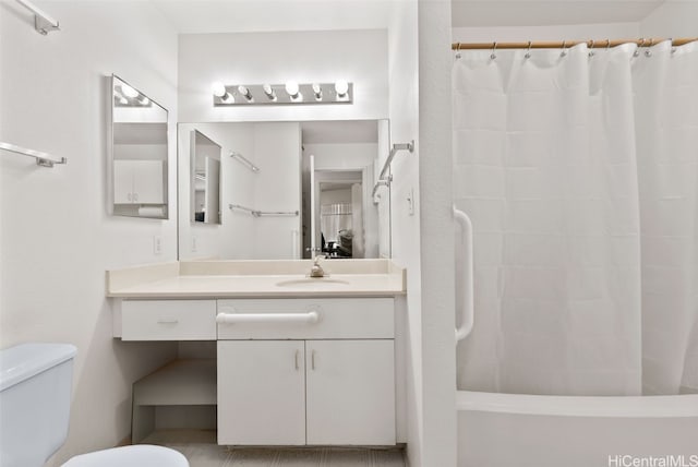 bathroom featuring shower / bath combo, vanity, and toilet