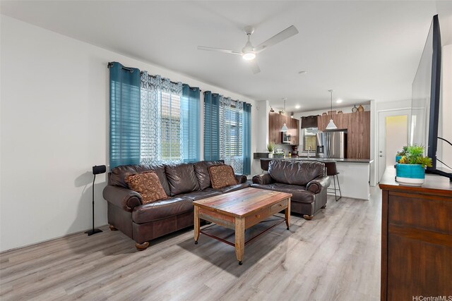 94-1251 Hale Halawai Dr Unit 6, Waipahu, HI 96797 - living room featuring light wood-type flooring and a ceiling fan
