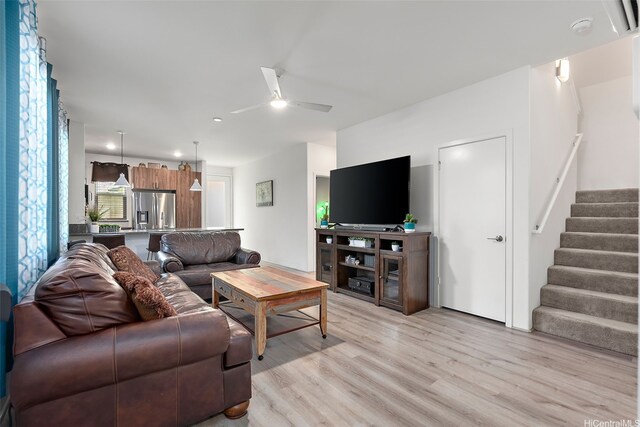 94-1251 Hale Halawai Dr Unit 6, Waipahu, HI 96797 - living room with light wood finished floors, stairs, and a ceiling fan