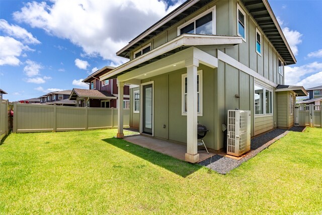 94-1251 Hale Halawai Dr Unit 6, Waipahu, HI 96797 - back of property featuring board and batten siding and a patio area