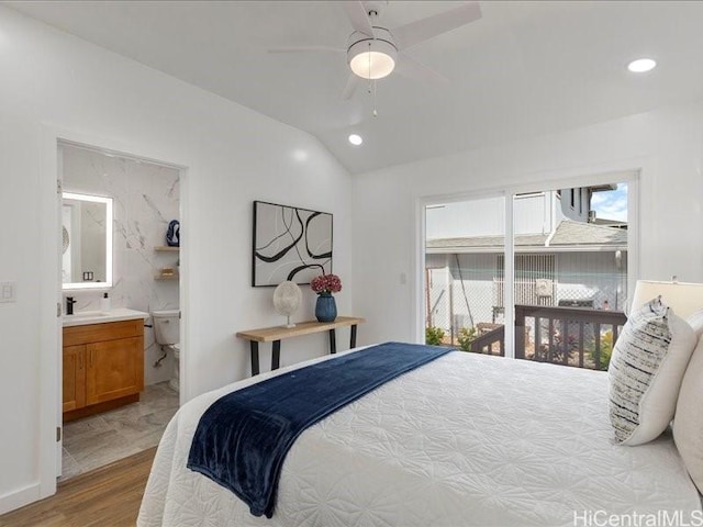 bedroom with a sink, ensuite bath, recessed lighting, light wood-style floors, and lofted ceiling