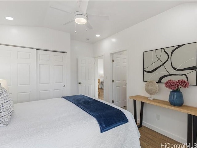 bedroom featuring recessed lighting, wood finished floors, a closet, and baseboards