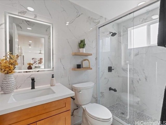 full bathroom with a marble finish shower, tasteful backsplash, tile walls, toilet, and vanity