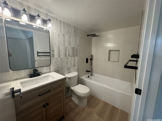 1296 Kapiolani Blvd Unit Ii-2509E, Honolulu, HI 96814 - bathroom featuring tile walls, wood finished floors, toilet, vanity, and shower / washtub combination