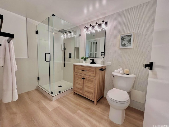 1296 Kapiolani Blvd Unit Ii-2509E, Honolulu, HI 96814 - full bathroom with vanity, wood finished floors, a stall shower, and toilet