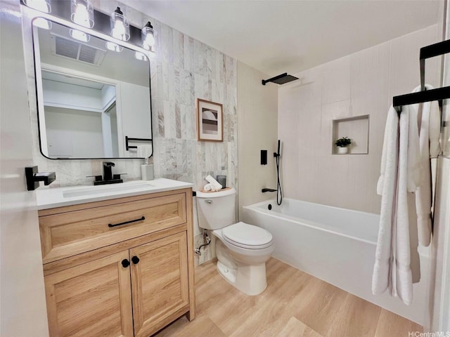1296 Kapiolani Blvd Unit Ii-2509E, Honolulu, HI 96814 - full bath featuring toilet, tile walls, wood finished floors, vanity, and shower / tub combination