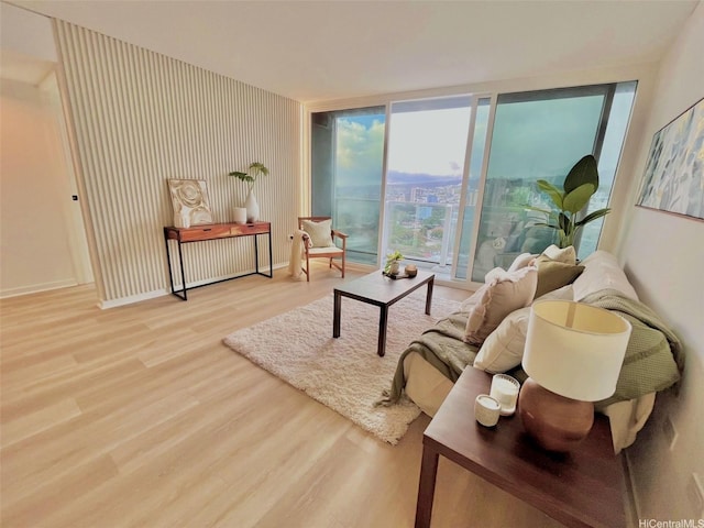 1296 Kapiolani Blvd Unit Ii-2509E, Honolulu, HI 96814 - living room with wood finished floors, baseboards, and expansive windows