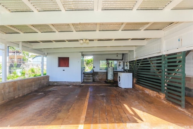 view of patio / terrace featuring water heater and washer / clothes dryer