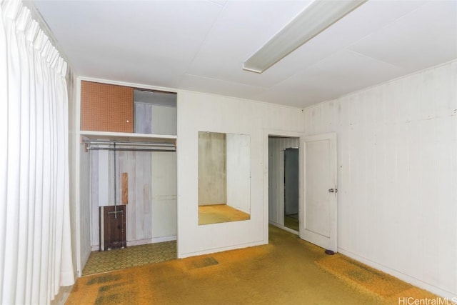 unfurnished bedroom featuring carpet floors and a closet