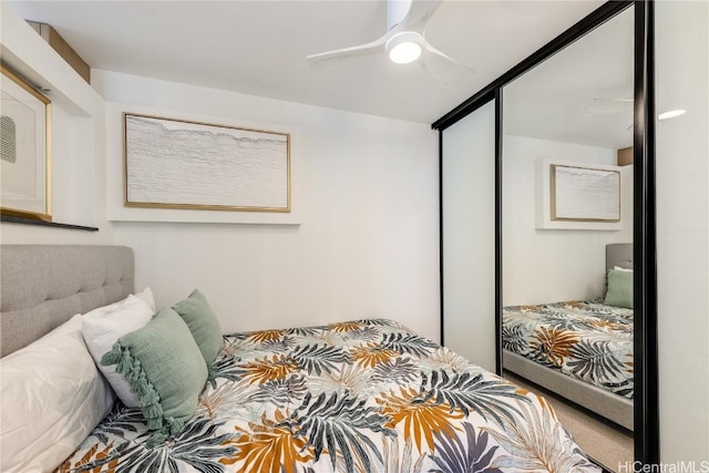 bedroom with carpet and a ceiling fan