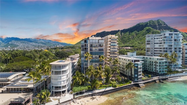 exterior space with a water and mountain view