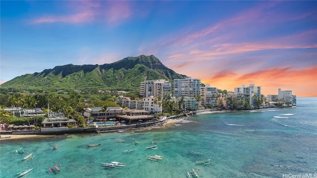 property view of water featuring a mountain view and a city view