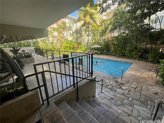 view of pool featuring a fenced in pool and a patio