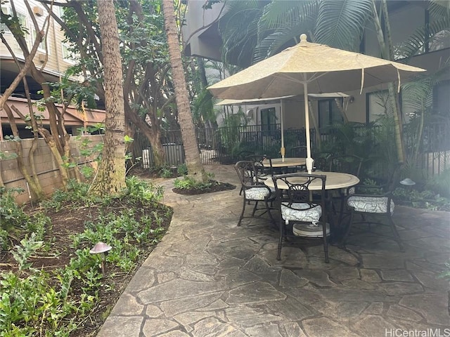 view of patio / terrace with outdoor dining space and fence