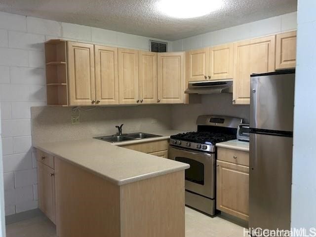 2714 Kahoaloha Ln Unit 503, Honolulu, HI 96826 - kitchen with appliances with stainless steel finishes, a sink, under cabinet range hood, light brown cabinetry, and a peninsula