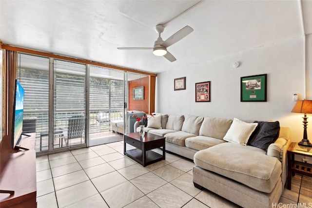 living room featuring floor to ceiling windows, ceiling fan, and light tile patterned flooring