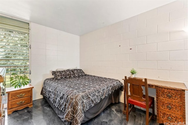 bedroom with finished concrete flooring