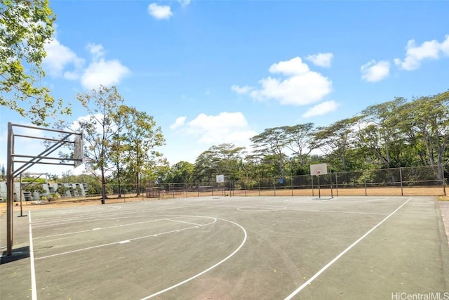 view of sport court featuring community basketball court and fence