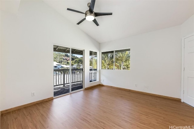 unfurnished room featuring high vaulted ceiling, ceiling fan, baseboards, and wood finished floors